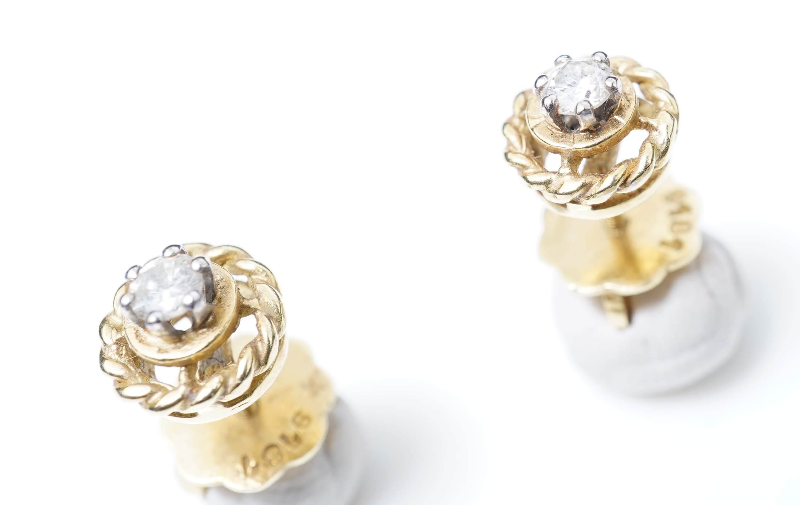 A pair of diamond stud earrings